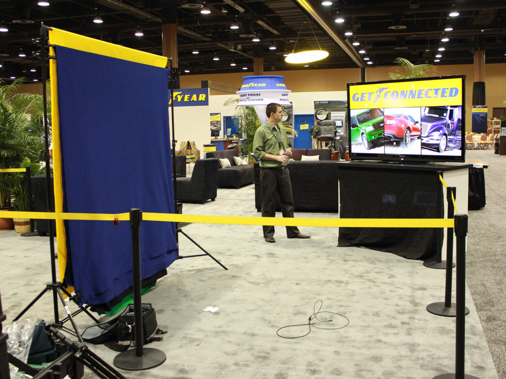 Wide layout of the Goodyear Dealer Conference 2012 booth showcasing mosaic screens and signage