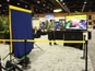 Wide layout of the Goodyear Dealer Conference 2012 booth showcasing mosaic screens and signage