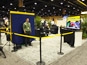 Overview of the Goodyear booth with mosaic display and guest interaction zones