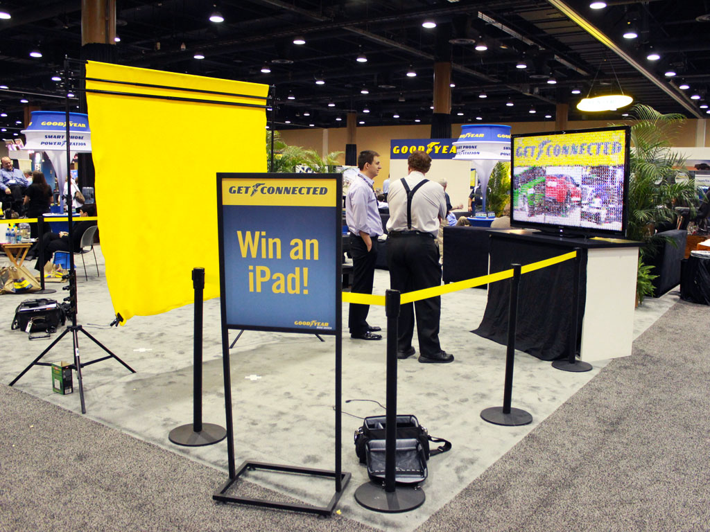 Detailed booth setup highlighting mosaic display screens at the Goodyear Dealer Conference 2012