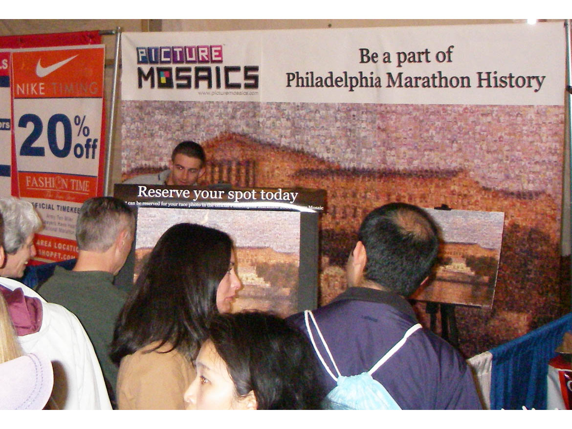 Crowd gathered around the interactive photo mosaic booth at the Philadelphia Marathon.
