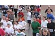 Thumbnail of marathon runners having their photos captured mid-run for the interactive photo mosaic.