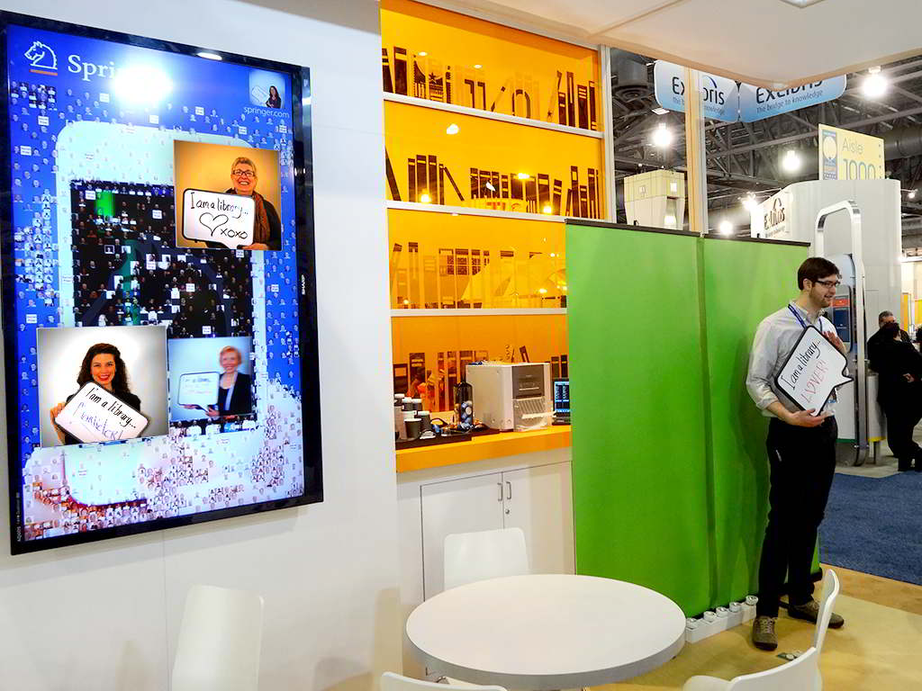 Guest having their photo taken for Springer’s digital mosaic at the ALA Midwinter Meeting