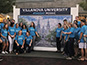 Villanova group photo in front of the mosaic wall.