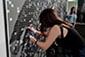 Backstreet Boys: The Experience – Thumbnail of a fan interacting with the mosaic wall.