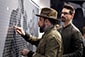 Backstreet Boys: The Experience – Thumbnail of AJ McLean placing a photo on the mosaic wall.