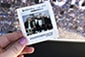 Backstreet Boys: The Experience – Thumbnail of a guest holding a printed photo takeaway.