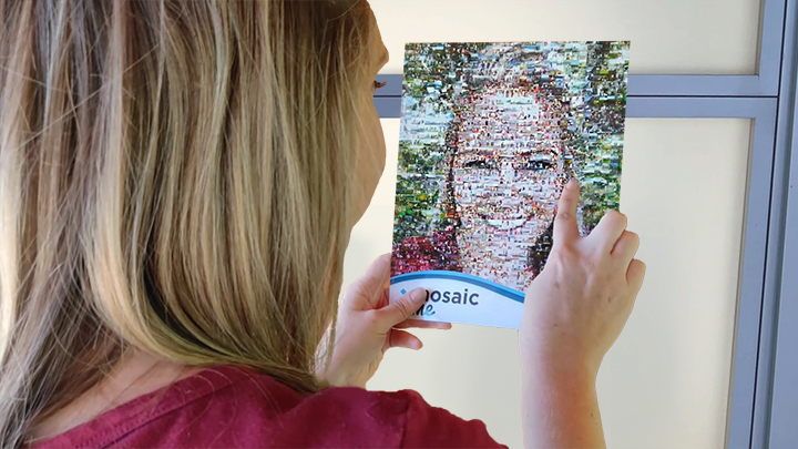 Women looking at a photo mosaic print of herself that was printed within seconds